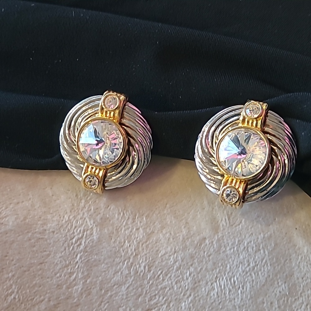 Vintage Silver and Gold with clear Stone Center.
